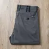 Pantalones casuales ajustados rectos pequeños de hombre de lyocell fino de seda helada transpirables suaves con caída de alta gama color gris oscuro para hombre