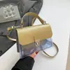 Nuevo Jelly 2025 Nuevo Lock Verano Simple Transparente Empalmado Moda de Mano Bandolera Hombro Bolsa Cuadrada Pequeña