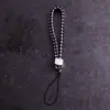 Lanyard para teléfono móvil al por mayor de fábrica, cordón para llavero de cámara de cuero PU, cuerda de muñeca para teléfono móvil de pareja, cuerda tejida de cuero