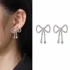 Enamórate de los pendientes de borla de lazo asimétricos Yi Nengjing, pendientes de temperamento de Corea del Sur, pendientes de moda para mujer