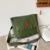 Mochila del Ejército Rojo, diseñada para servir al pueblo, una gran herramienta de aprendizaje, bolso cruzado, estilo vintage, mochila Verde Liberación, material de lona, diseño de cinco estrellas, mochila Lei Feng
