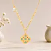 Nuevo Colgante de Flor de Esmalte Chino Trébol de Cuatro Hojas Hueco Oro Arena Colgante Azul Quemado Collar de Lujo Ligero de Nicho para Mujer Chapado en Oro