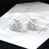Pendientes de otoño con forma de ojo de gato, diseño de moda de Corea del Sur, con forma de aguja de plata S925, para mujer, bonitos y dulces, para estudiantes.