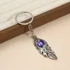 Collar Personalizado Ojo de Diablo con Pluma, Llavero de Coche de Acero Inoxidable de Nicho, Cadena Decorativa para Suéter