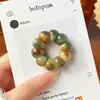 Mismo estilo que Xiaohongshu descompresión ajo grande intestino raíz de bodhi hilado a mano punta del dedo juego cultural artículo de mano para jugar con cuentas budistas pulsera de cuentas de oración femenina