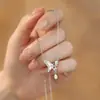 Collar de Plata de Ley S999 con Mariposa de Concha Blanca para Mujer Cadena de Clavícula con Borla Explosiva Gota de Agua Circonita Moda Lujo Accesible Sentido de Gama Alta