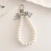 Nuevo Llavero de Perlas Colgante de Cuentas Colgante de Lazo Llavero de Oso con Lazo Placa Metálica Pulsera de Perlas