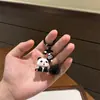 Encantador llavero de panda de resina 3D, animal de dibujos animados con lazo, dulce y adorable, perfecto como regalo para estudiantes o mejores amigos para colgar en sus mochilas