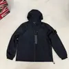 Chaqueta Funcional con Capucha Cortavientos para Hombre y Mujer de Comercio Exterior de Isla Dobladillo con Cordón Corte Recto Holgado Ropa de Trabajo Funcional Italiana