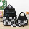 Nova mochila escolar transfronteiriça para alunos do ensino primário Cor de contraste de três peças feminina estilo coreano saco de ombro de grande capacidade saco de lancheira de isolamento atacado