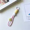 Rosto Sorridente de Dopamina Acessórios de Corda Trançada Estilo Doce Cool Pingente de Alto Valor Pingente de Bolsa Chaveiro Novo Modelo para Mulheres