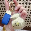 Shuibeijin 999 Oro Puro Bolsa de la Fortuna Llavero Colgante Accesorio para Bolso Regalo para el Cumpleaños de la Novia