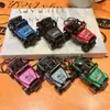 Llavero creativo de mini coche deportivo de fricción, coche de aleación con puertas que se abren, accesorio para mochila infantil, regalo de coche