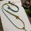 Collar con Colgante Hecho a Mano con Cuerda Trenzada de Flor de Durazno, Colgante Ajustable de Jade Dorado, Ocho Hilos de Alta Gama