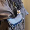 Bolsas de Moda 2026 Nova Bolsa de Mão em Forma de Lua Crescente para Mulheres, Estilo de Nicho, Bolsa de Ombro e Transversal Texturizada, Bolsa de Braço Versátil e Estilosa
