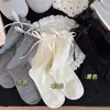 26 Estilos Nuevos de Calcetines a Media Pantorrilla Estilo Jk Lolita con Puños de Burbuja, Lazos de Cinta y Calcetines Apilados de Zhuji, Calcetines Sin Costuras