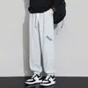 Calças de moletom jogger plus size para homens, novas calças de moletom da moda com cordão para primavera e outono, calças compridas casuais soltas emagrecimento estilo americano
