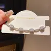 Pulseira Retrátil Geométrica Oval com Zircônia Estilo Luxo Leve Retro Francês Exquisita de Nicho Alta Costura Joia de Mão para Mulheres