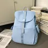 Mochila Ice Mist Azul Claro com Aba e Múltiplos Bolsos para Casais, Estilo Descontraído para Viagens ao Ar Livre e Ciclismo, Disponível em Tamanhos Pequeno e Grande