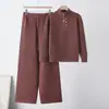 Estilo outono e inverno novo da Amazon transfronteiriço, top simples de malha com gola alta e zíper parcial e calça pantalona com decoração de botão da moda
