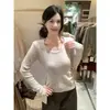 Tejido de lana suave y delicado textura de lino fino escote adelgazante top de punto para mujer otoño sensación relajada top versátil naranja