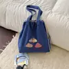 Nova coleção outono 2026 estilo coreano: bolsa de mão estampada para mulheres, grande capacidade, design casual e simples, bolsa sacola portátil com cordão