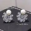 Pendientes coreanos simples de circón incrustado en cobre, pendientes exquisitos de circón de copo de nieve y perla, pendientes de temperamento lindos de alta gama