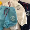 Calça Infantil 2026 Outono/Inverno Novo Estilo Meninos e Meninas Estampa de Desenho Moletom Felpudo Calça Casual Quente com Punho para Bebê
