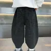 Pantalones para Niños Primavera y Otoño 2026 Nuevos Estilo Coreano Moda Cuadros Pierna Ancha Pantalones Casuales Versátiles Largos