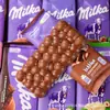 Chocolate importado de Alemania MILKA plato grande sándwich de leche de avellana tarjeta maravillosa chocolate de burbujas de panal