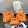 2026 Novo Modelo Couro Bovino Camada Superior Couro Togo Bolsa Kelly Bolsa de Mão Ombro Transversal Bolsa Feminina Atacado Transfronteiriço