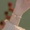 Pulseira Pérola da Bênção para Mulheres com Pingente de Pérola Sino da Bênção, Pulseira de Luxo Leve, Joia com Design Vintage Ins de Nicho