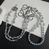 Cadena para teléfono larga de perlas en forma de gota, a la moda y versátil, con un diseño de nicho, que ofrece una sensación de alta gama y elegancia para el uso diario y como accesorio para bolso.