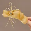 Pinza Plátano Plisada Vertical con Lazo Floral para Cola de Caballo de Verano 2026 Nuevos Pasadores para la Parte Posterior de la Cabeza Accesorios para el Cabello