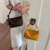 Bolso tote tejido de alta gama para mujer 2026 nuevo versátil elegante bolso de un solo hombro cruzado bolso de un solo hombro casual bolso de mujer