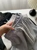 Pantalones casuales de pierna ancha, cropped, de cintura alta, favorecedores de la figura, estilo coreano para mujer, colección otoño 2026, con cordón, bolsillos y diseño de color liso, con una ligera curva en el dobladillo
