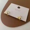 Pendientes de lazo pequeño para mujer, diseño de nicho, sencillos, elegantes, combinables, de moda, para ir al trabajo, de alta gama.