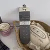 Meias florais pequenas japonesas femininas série outono e inverno cinza meias retrô de cano médio bainha de bolha doce bloqueio de cores meias sem costura largas
