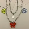 Moda de joyería transfronteriza europea y americana, color versátil, colgante de mariposa acrílica, cadena para la cintura, cadena corporal de aleación de estrella de cinco puntas para mujer