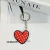 Llavero de goma suave, forma de corazón, caricatura, anime, celebridad, pareja, accesorio para bolso y mochila, disponible para venta al por mayor