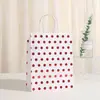 Bolsa de regalo creativa simple al por mayor punto dorado lunares bolsa de embalaje nueva fiesta cumpleaños compras portátil piel de vaca