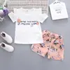 Verano Tendencia Infantil Nuevo Manga Corta Niñas Transpirable Inglés Cuello Redondo Manga Corta Casual Shorts Traje Infantil Tendencia Cabello