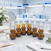 Botella Nueva Marrón con Forma de Calabaza, Botella de Vidrio con Gotero, Botella Dispensadora de Dos Colores, Botella Cosmética, Botella Pequeña para Medicamentos, Diversas Especificaciones al por Mayor