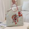 HINEZHA Moda de celebridad de Internet bordado de tendencia bolsa de compras de nailon transfronteriza casual para todo combinar bandolera para ir al trabajo