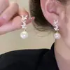 Pendientes retro franceses para mujer estilo Hong Kong elegantes para socialité largos de alta calidad lujo ligero de moda elegantes de perla pequeños pendientes de fragancia
