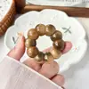 Mini Dente de Alho Raiz de Bodhi Pequeno Brinquedo Torcido à Mão para Alívio de Estresse para Homens e Mulheres, Brinquedo de Ponta de Dedo de Semente de Bodhi, Ornamento de Contas Budistas para Segurar no Punho Venda por Atacado