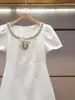 Vestido de Verano Nuevo Estilo Francés Elegante con Pedrería y Lentejuelas y Lazo de Manga Corta para Mujer de Ropa Fina Nanyou Shenzhen