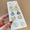 Pendientes de Corazón con Lazo Incrustado de Diamantes y Perlas Estilo Coreano Juego de Diez Piezas, Pendientes de Moda y Versátiles, Pendientes de Lujo Ligero y de Alta Gama para Mujer