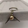 Colgante de Llave de Snitch Dorada Europea y Americana Llavero de Aleación Estilo Bohemio Harry Potter Venta al por Mayor Yiwu