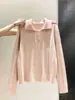 Suéter de punto tipo polo coreano para mujer, con diseño de tres botones, tela suave y cómoda, corte corto y holgado, y estilo dulce de manga larga, perfecto para otoño e invierno.